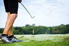 a person playing golf